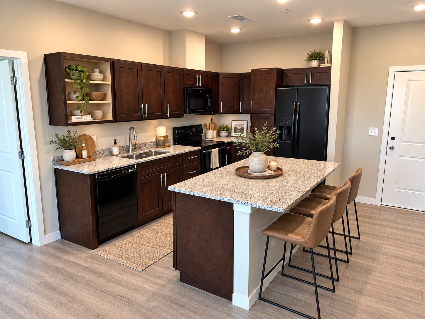 Modern kitchen with dark cabinets and island.