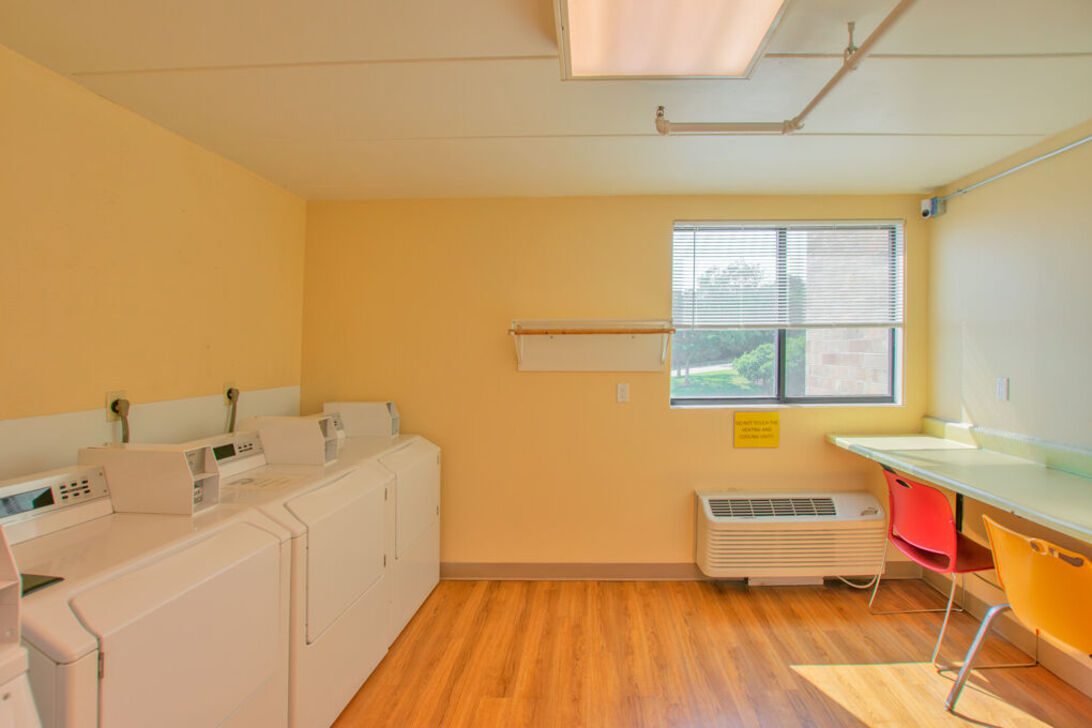 Laundry room with washers and folding table