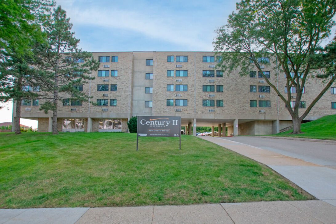 Century II apartment building with lawn