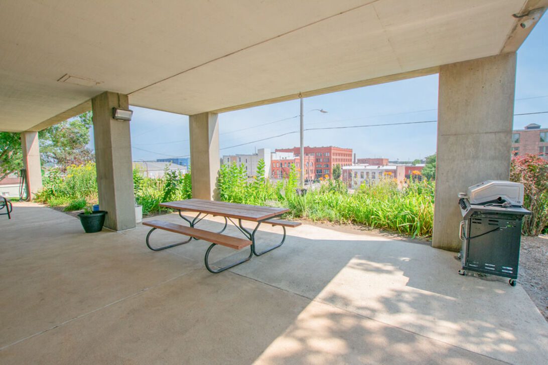 Covered picnic table and barbecue with city view