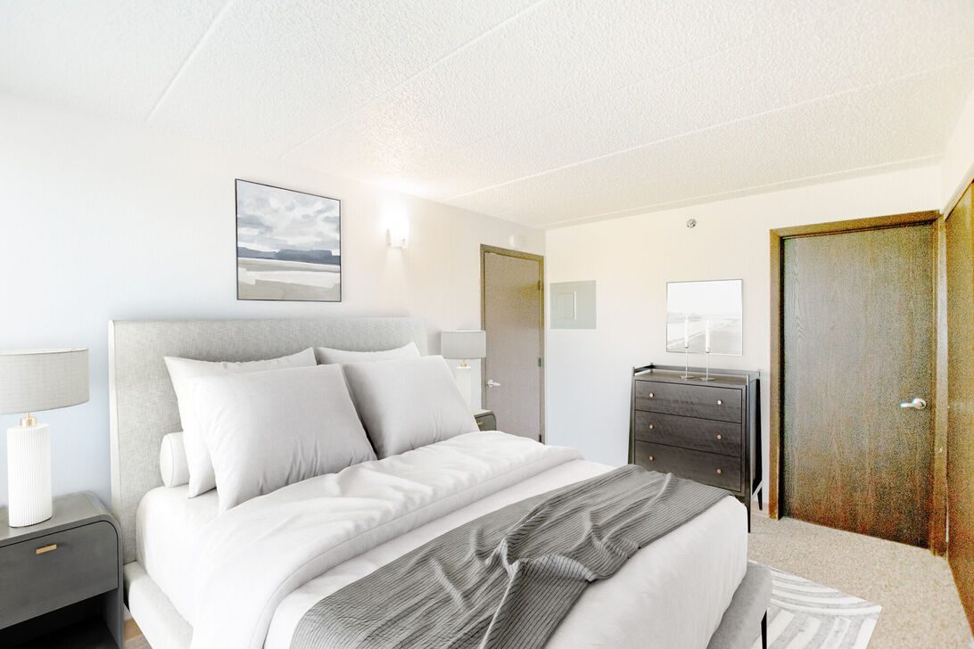 Bright minimalist bedroom with bed and dresser