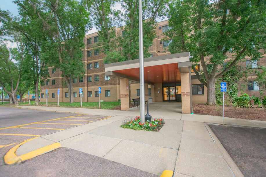Covered entrance to brick apartment building