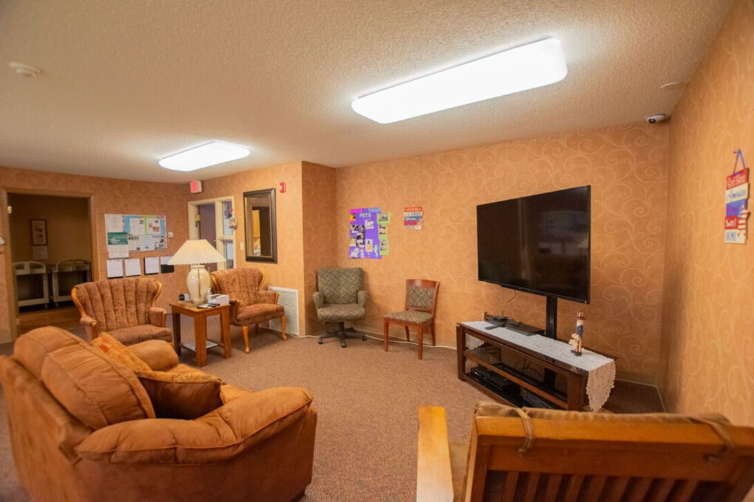 Cozy TV lounge with seating and flat-screen