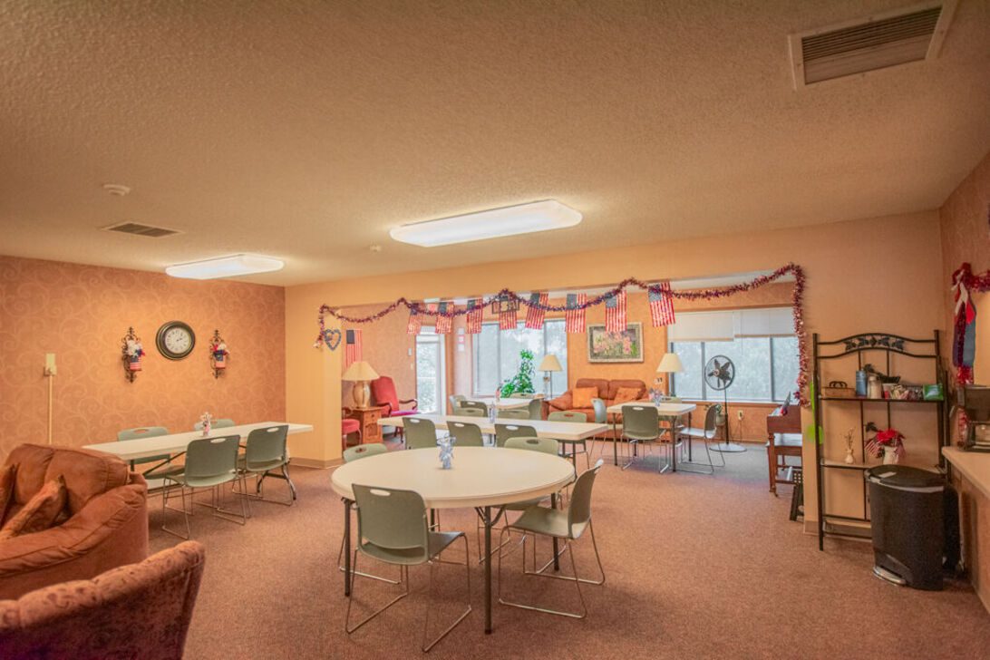Community lounge with round tables and chairs