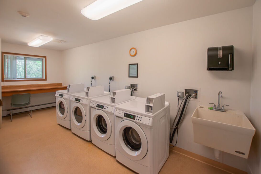Shared laundry room with four front-load washers