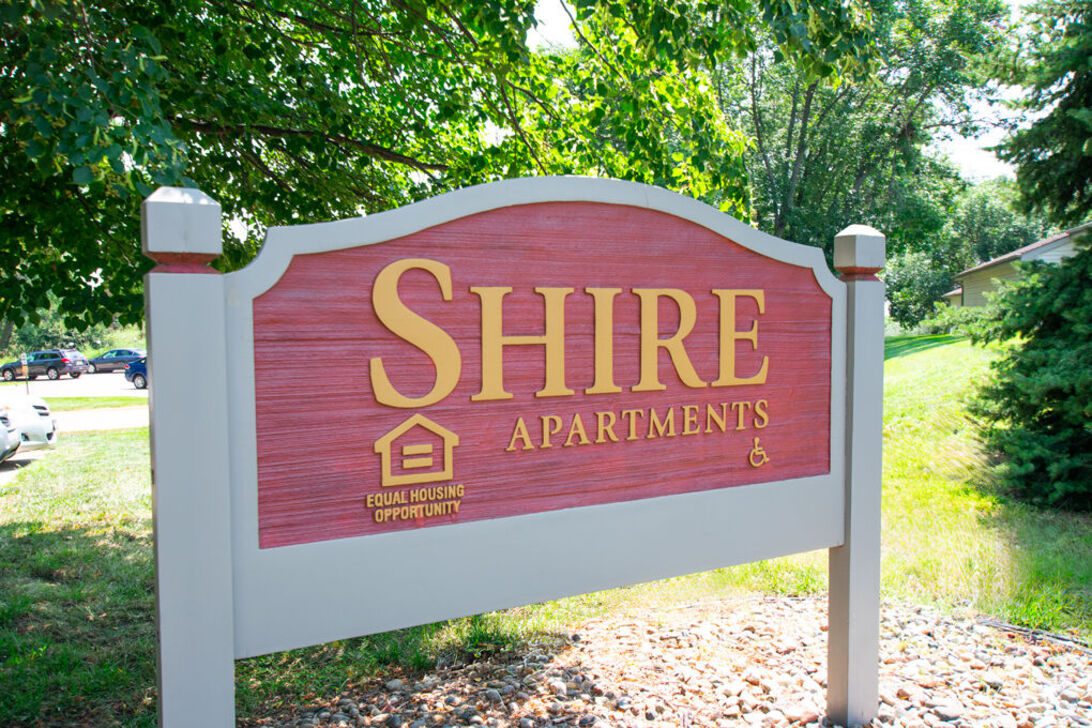 Shire Apartments wooden entrance sign