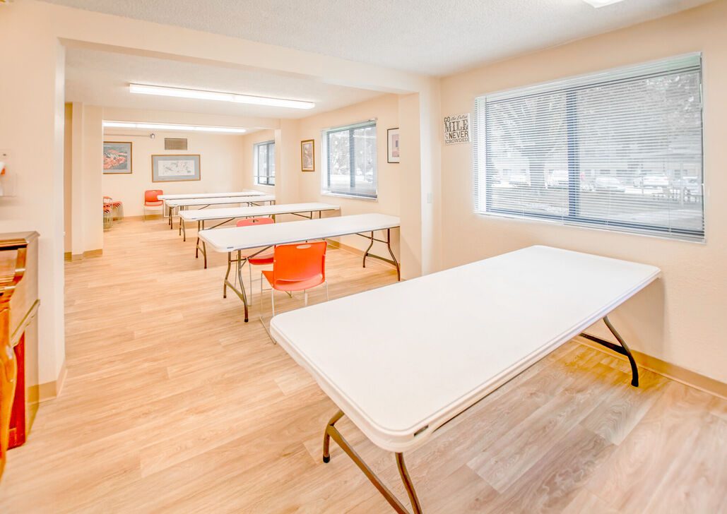 Empty meeting room with folding tables and chairs