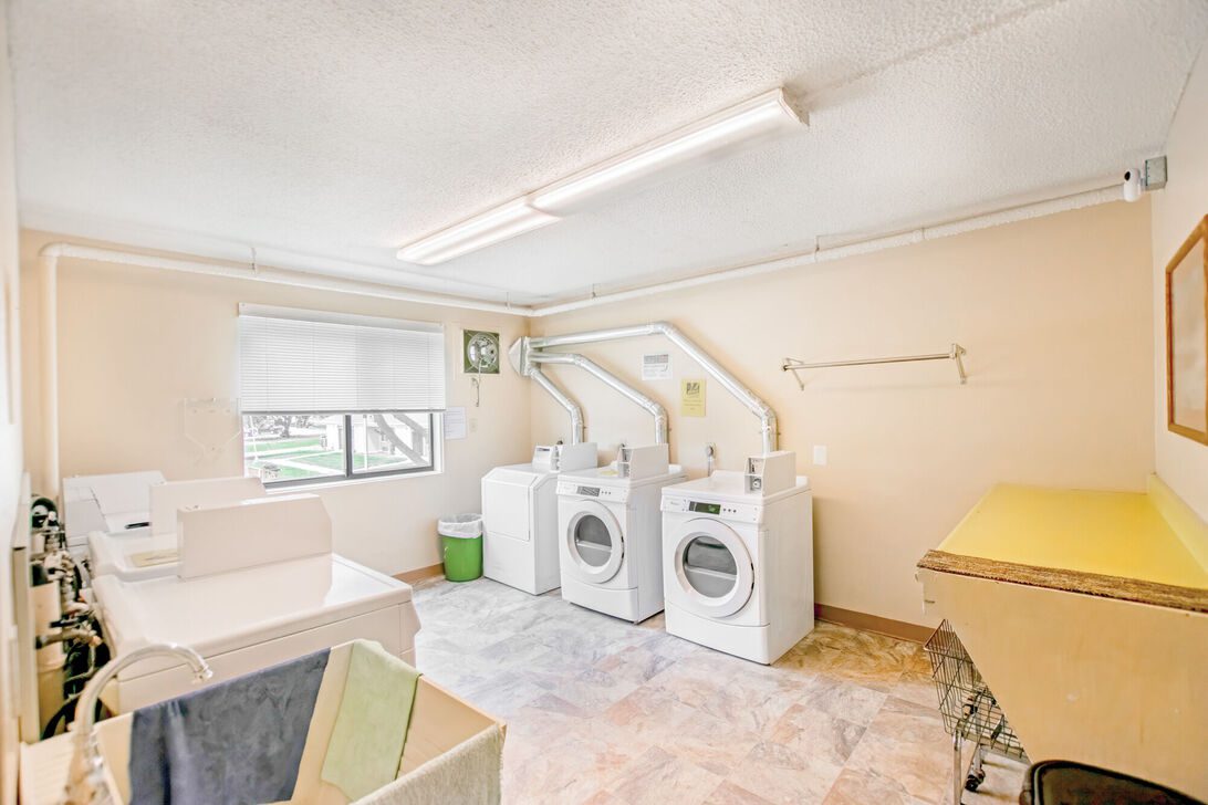 Laundry room with washers and dryers