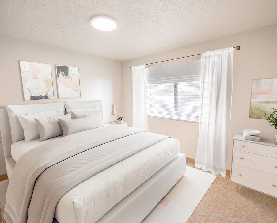 Bright modern bedroom with white bedding